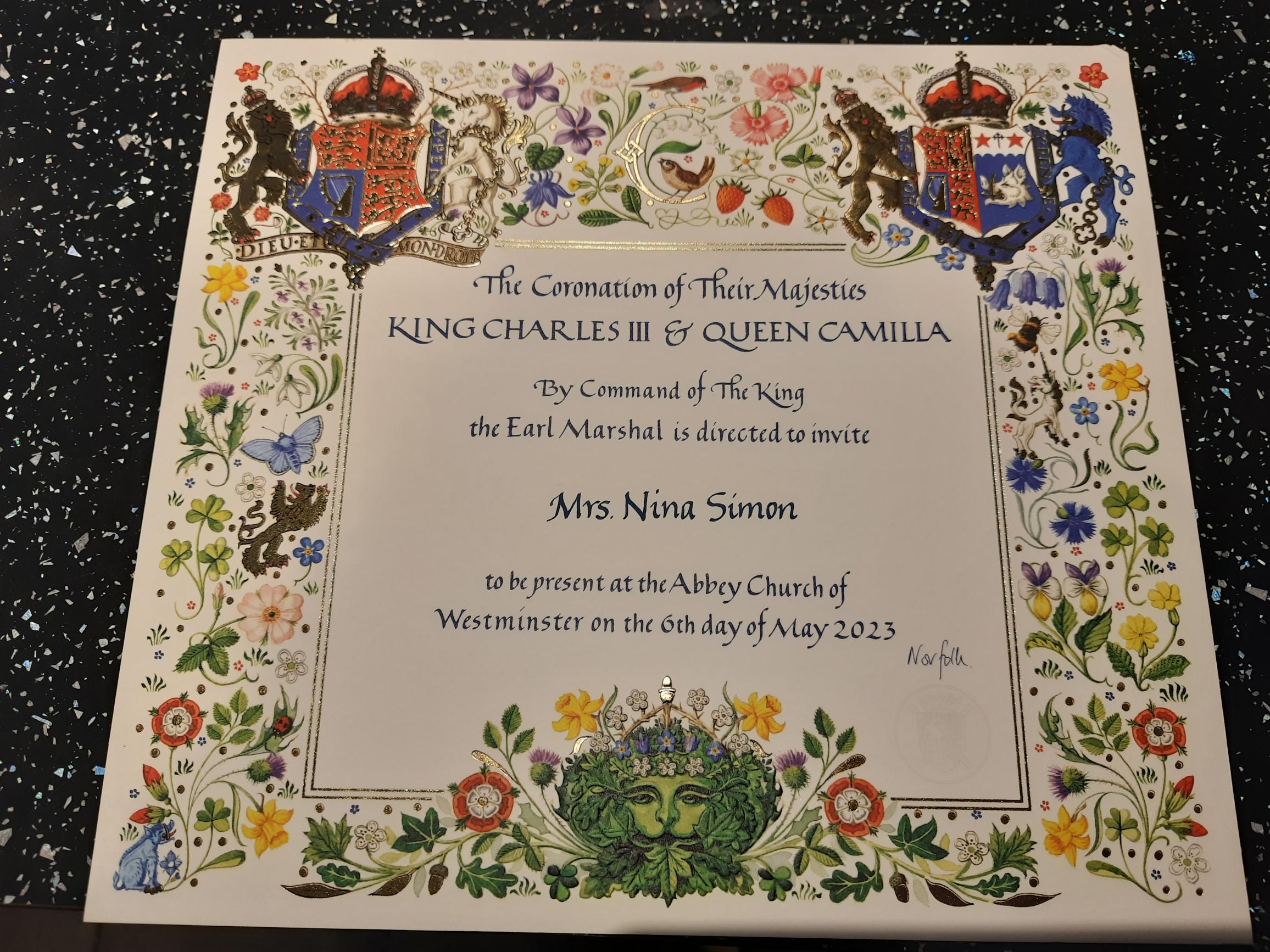 A picture of an invitation to the Coronation of King Charles III addressed to Mrs Nina Simon